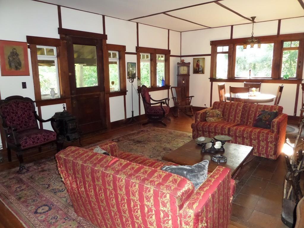 9 Bell Road Middlefield, MA 01243 - Photo 12 of 18 a living room with furniture a flat screen tv and windows