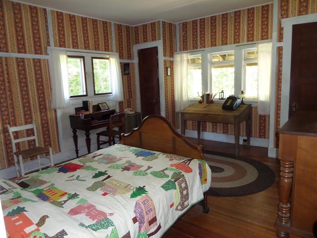 9 Bell Road Middlefield, MA 01243 - Photo 15 of 18 a bed sitting in a bedroom next to a window with pc on the table