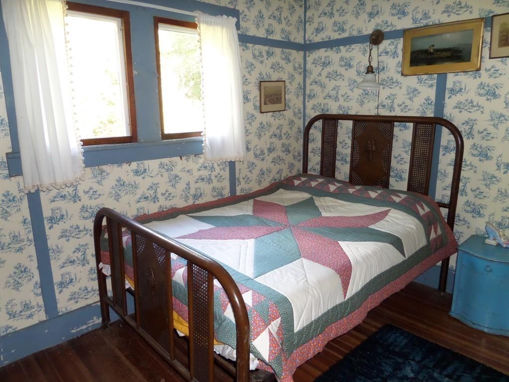9 Bell Road Middlefield, MA 01243 - Photo 16 of 18 a bedroom with a bed and a flat screen tv