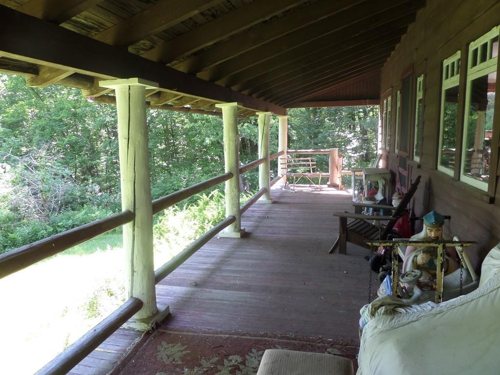 9 Bell Road Middlefield, MA 01243 - Photo 2 of 18 a view of a room with balcony and floor to ceiling windows