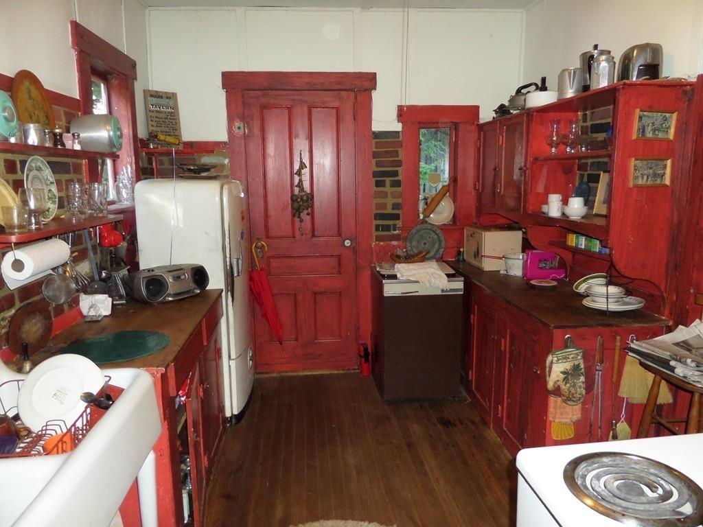 9 Bell Road Middlefield, MA 01243 - Photo 9 of 18 a kitchen with stainless steel appliances granite countertop a refrigerator a stove and wooden floor
