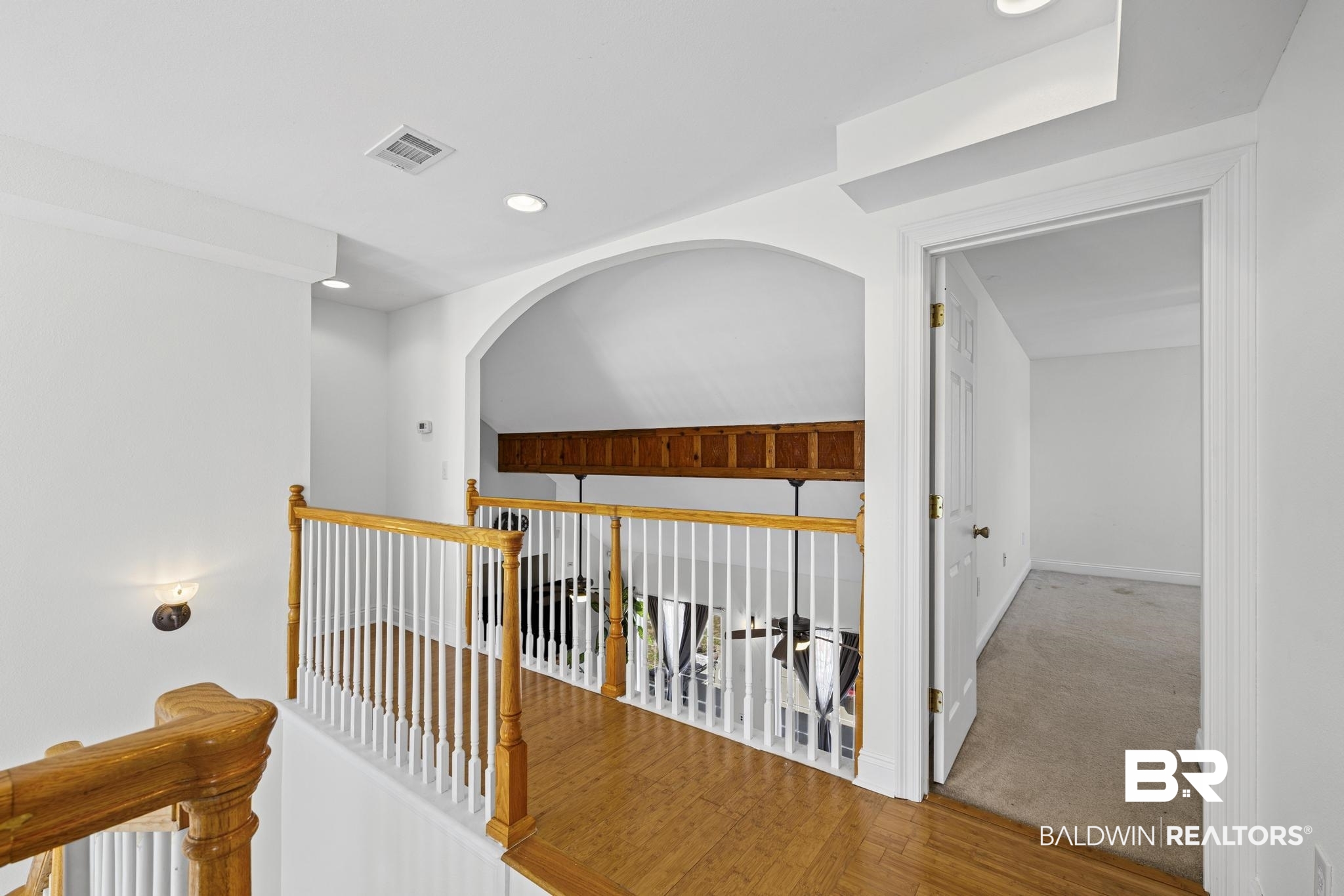 32875 Faircloth Road Lillian, AL 36549 - Photo 41 of 85 Hallway featuring carpet flooring, wood finished floors, and recessed lighting