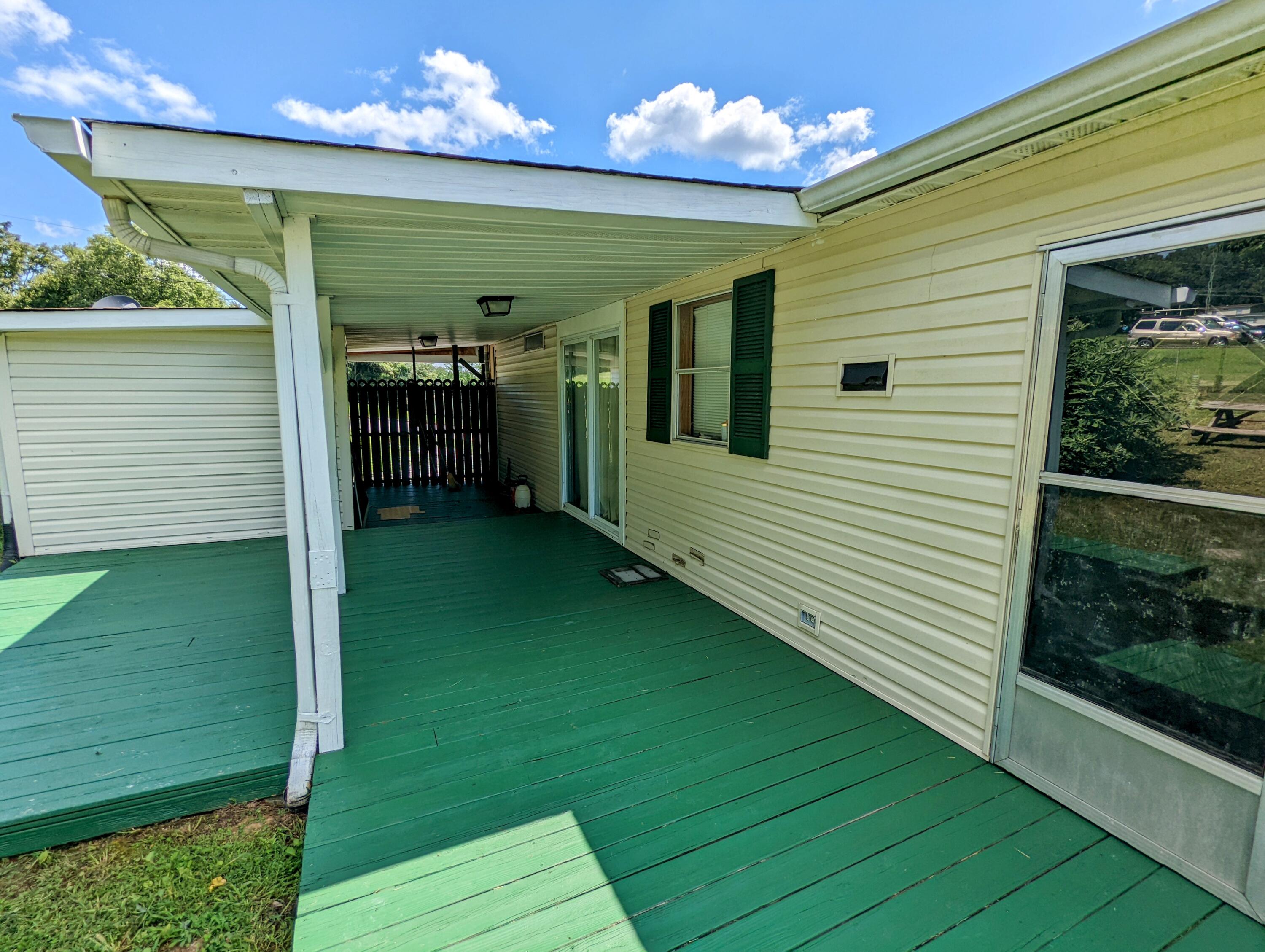 135 Beech Grove Road Telford, TN 37690 - Photo 6 of 33 Rear deck/patio