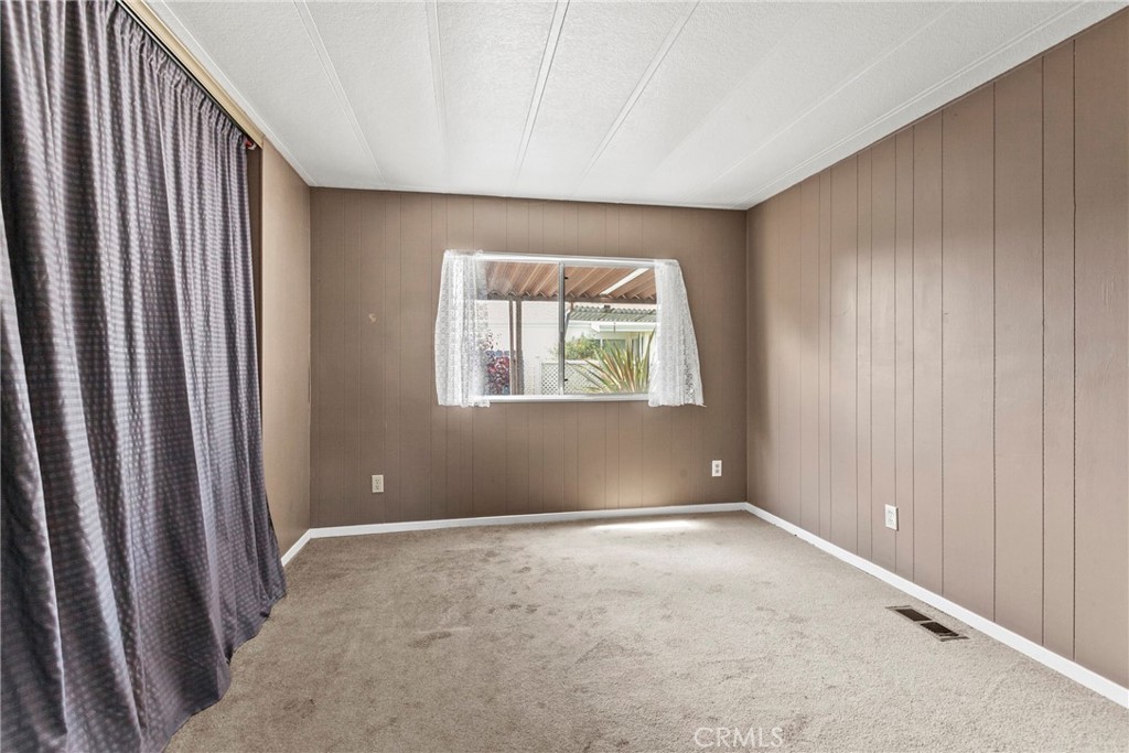 519 West Taylor Street, Unit 252 Santa Maria, CA 93458 - Photo 11 of 52 an empty room with windows