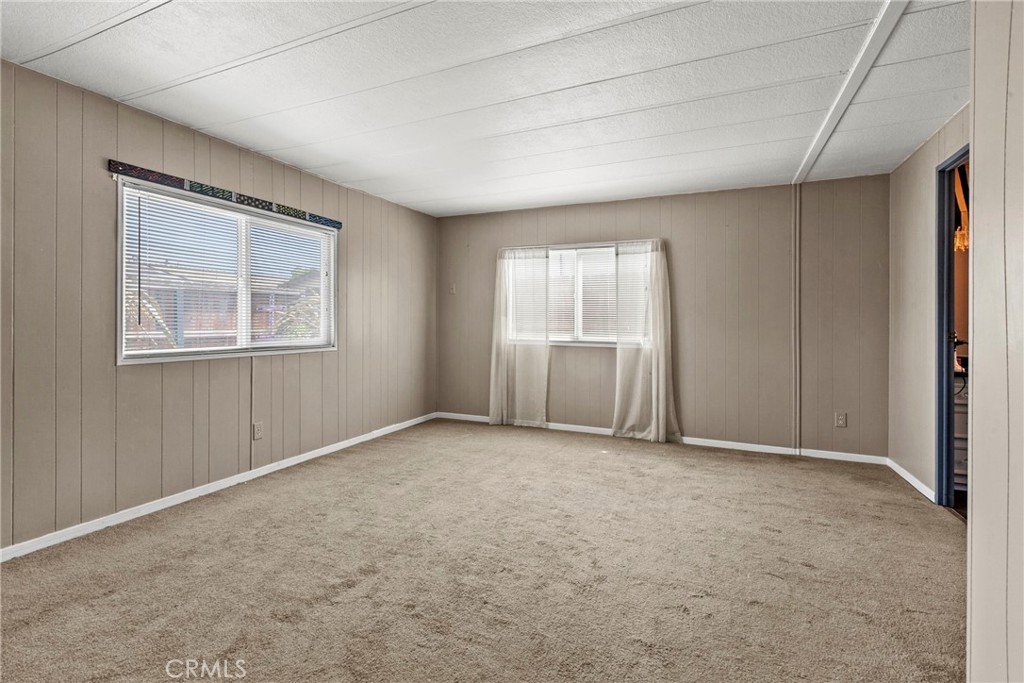 519 West Taylor Street, Unit 252 Santa Maria, CA 93458 - Photo 12 of 52 an empty room with windows and closet