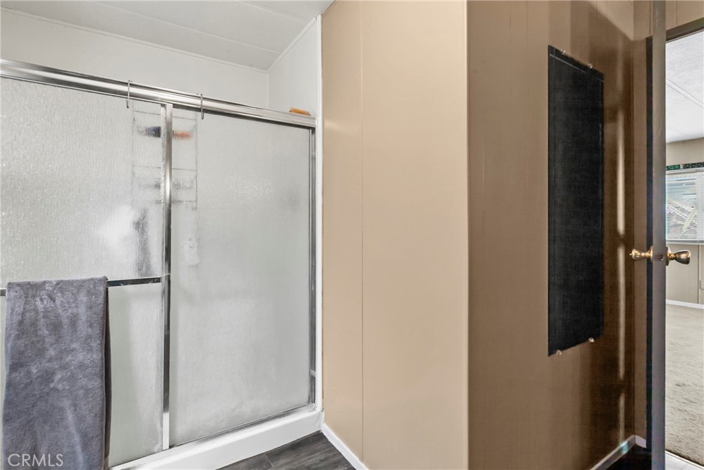 519 West Taylor Street, Unit 252 Santa Maria, CA 93458 - Photo 15 of 52 a bathroom with a glass shower door