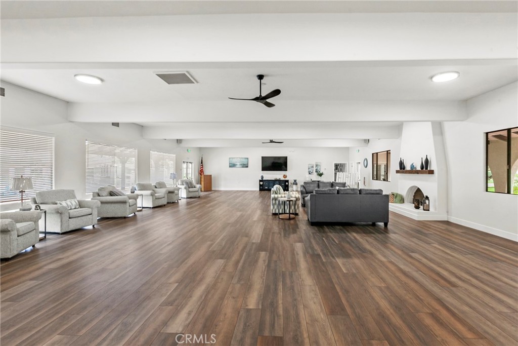 519 West Taylor Street, Unit 252 Santa Maria, CA 93458 - Photo 30 of 52 a living room with furniture and a wooden floor