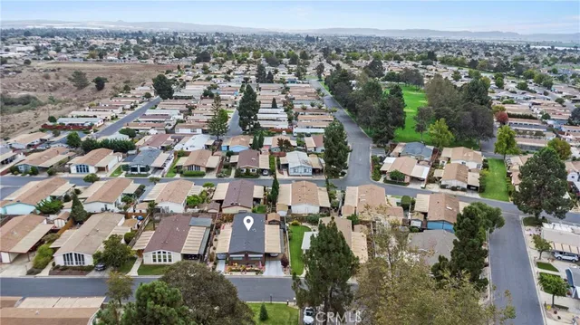 an aerial view of residential houses and outdoor space