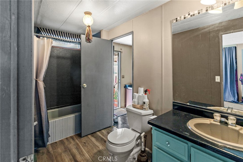 519 West Taylor Street, Unit 252 Santa Maria, CA 93458 - Photo 9 of 52 a bathroom with a sink a toilet and a mirror