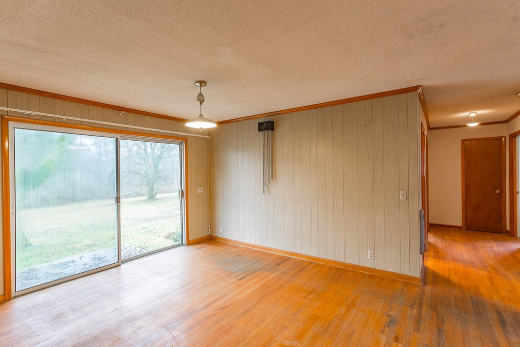 0 Tibbs Bridge Road Southeast Dalton, GA 30721 - Photo 4 of 22 a view of empty room with wooden floor and fan