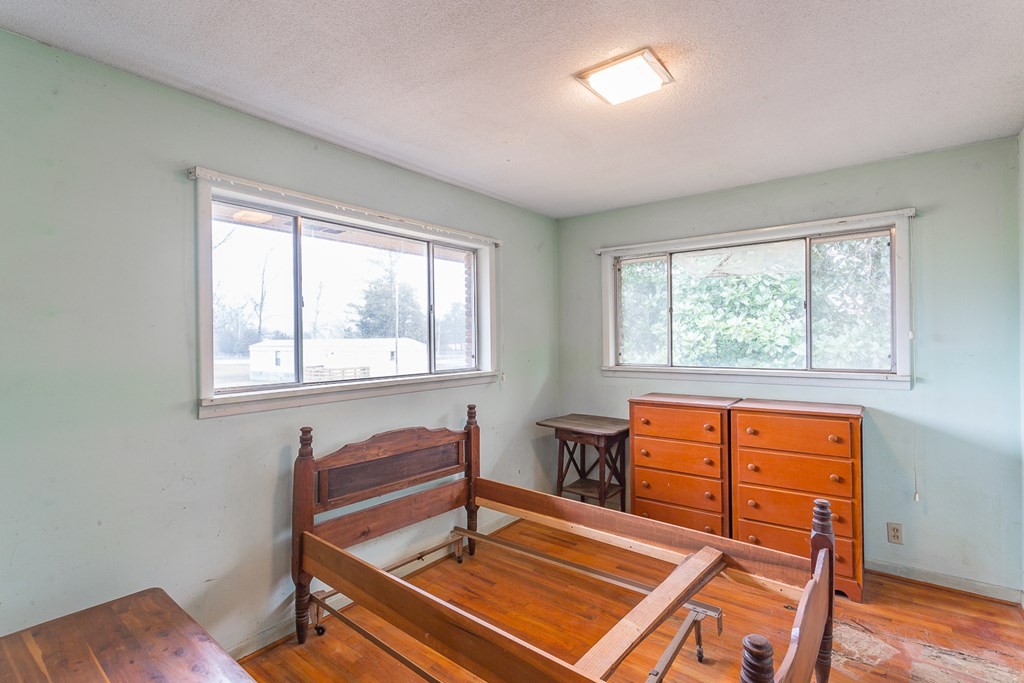 0 Tibbs Bridge Road Southeast Dalton, GA 30721 - Photo 7 of 22 a room with wooden floor and a window