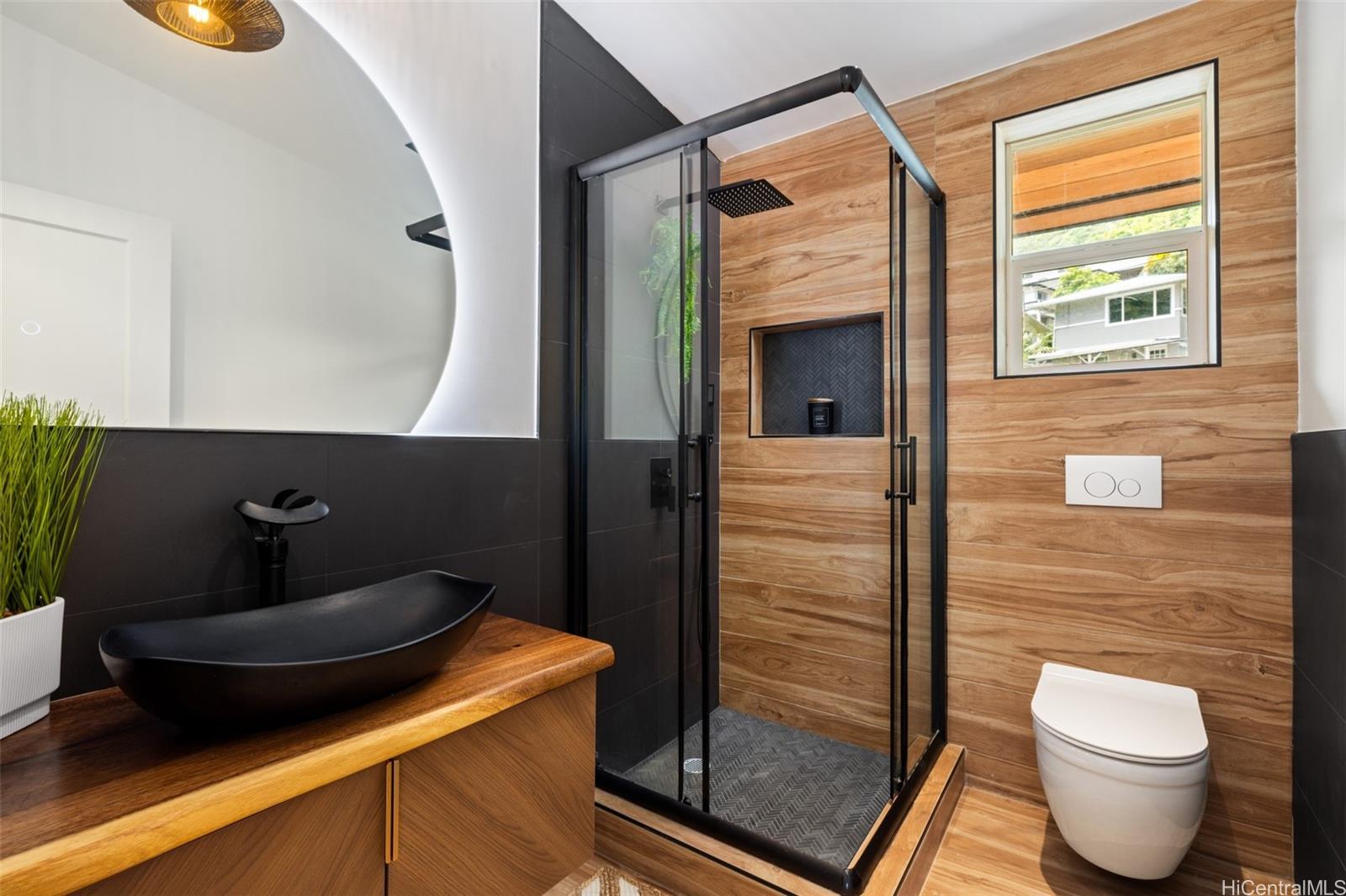 852 Kainoa Place Honolulu, HI 96821 - Photo 12 of 25 a bathroom with a sink and a mirror