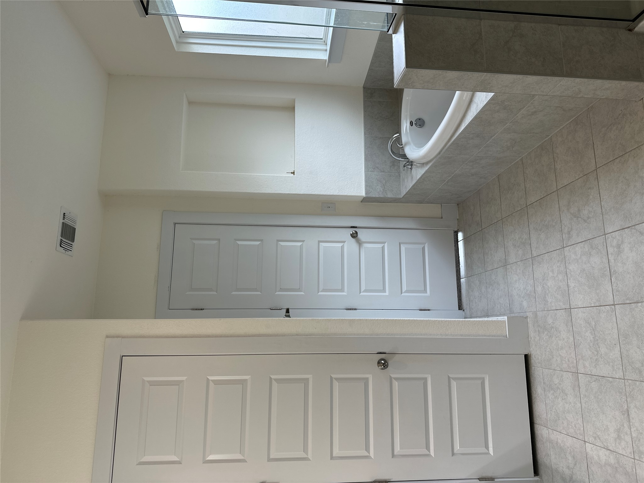 11204 Charger Way Manor, TX 78653 - Photo 14 of 21 a bathroom with a tub shower and closet