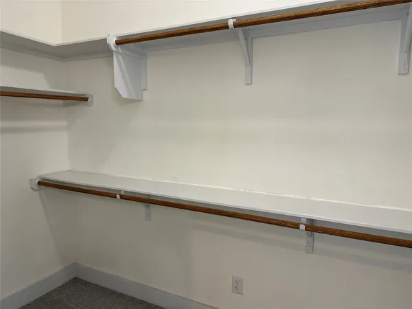 a bath tub sitting in a bathroom and mirror