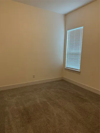 a view of a room that has a window in it