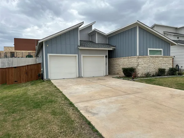a front view of house with garage