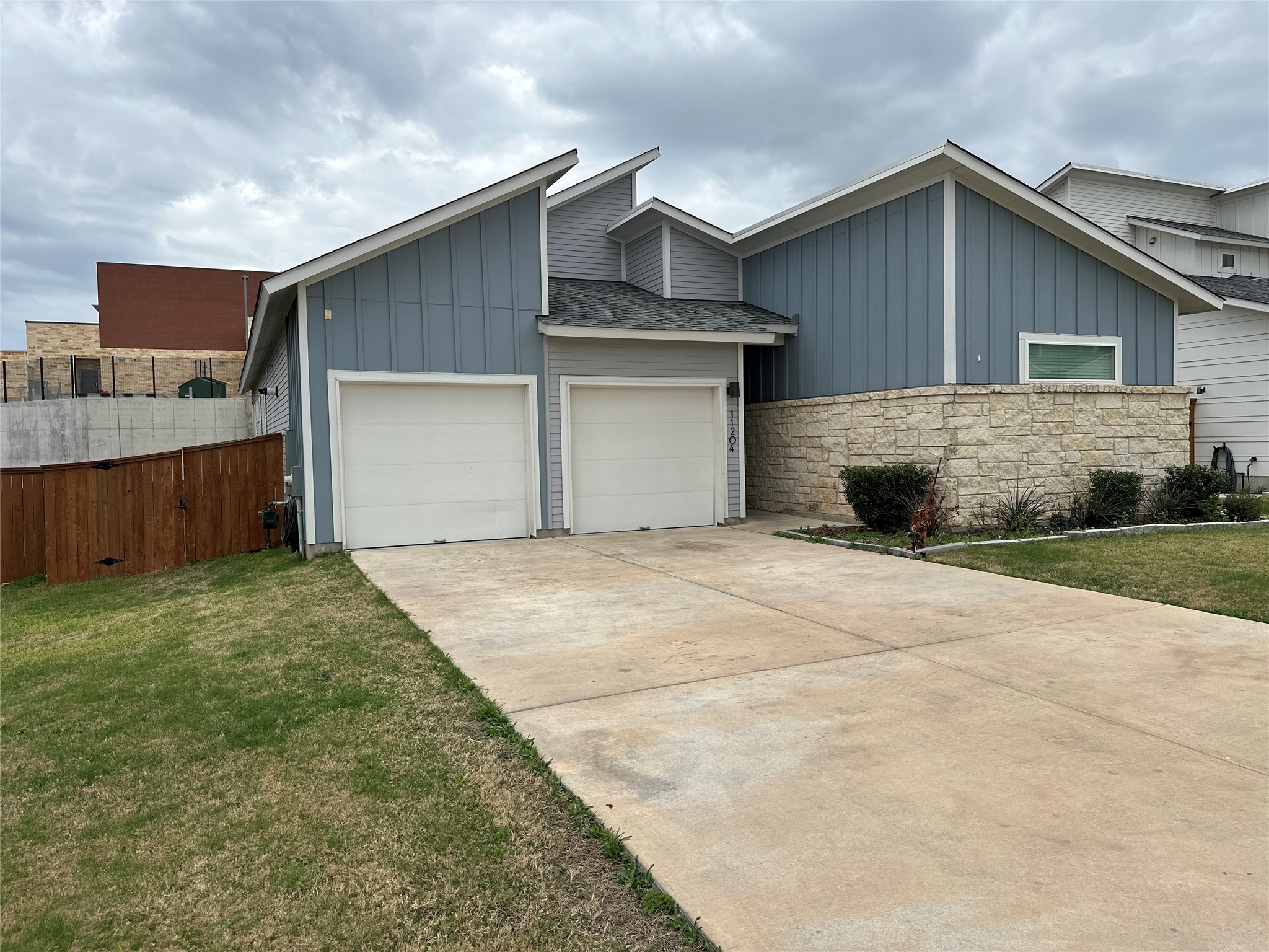 11204 Charger Way Manor, TX 78653 - Photo 3 of 21 a front view of house with garage