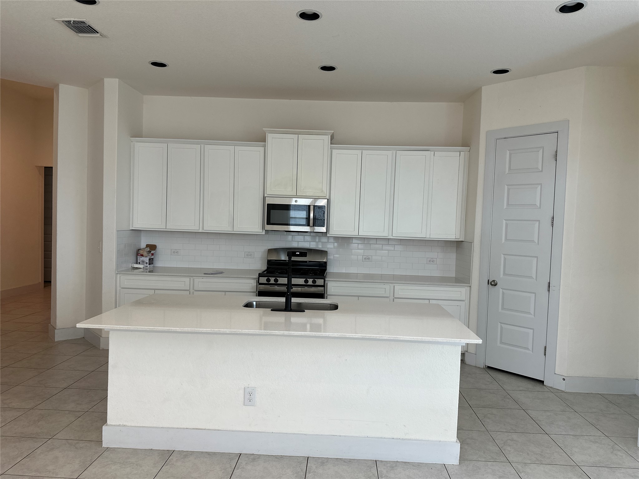 11204 Charger Way Manor, TX 78653 - Photo 6 of 21 a view of kitchen with white cabinets