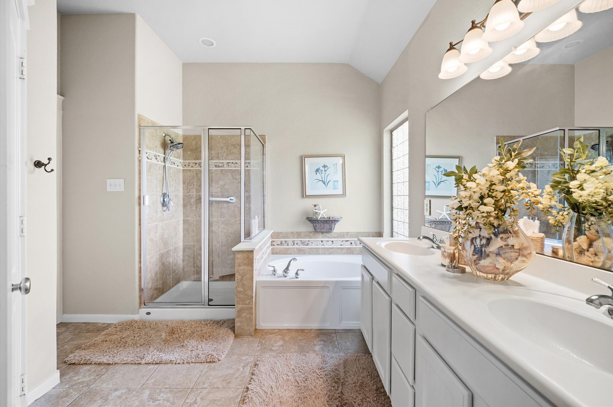 1603 Claytons Bend Court Spring, TX 77386 - Photo 26 of 38 This spacious bathroom features a glass-enclosed shower, a large soaking tub, dual sinks with ample counter space, elegant lighting, and tasteful decor. It's both functional and inviting.