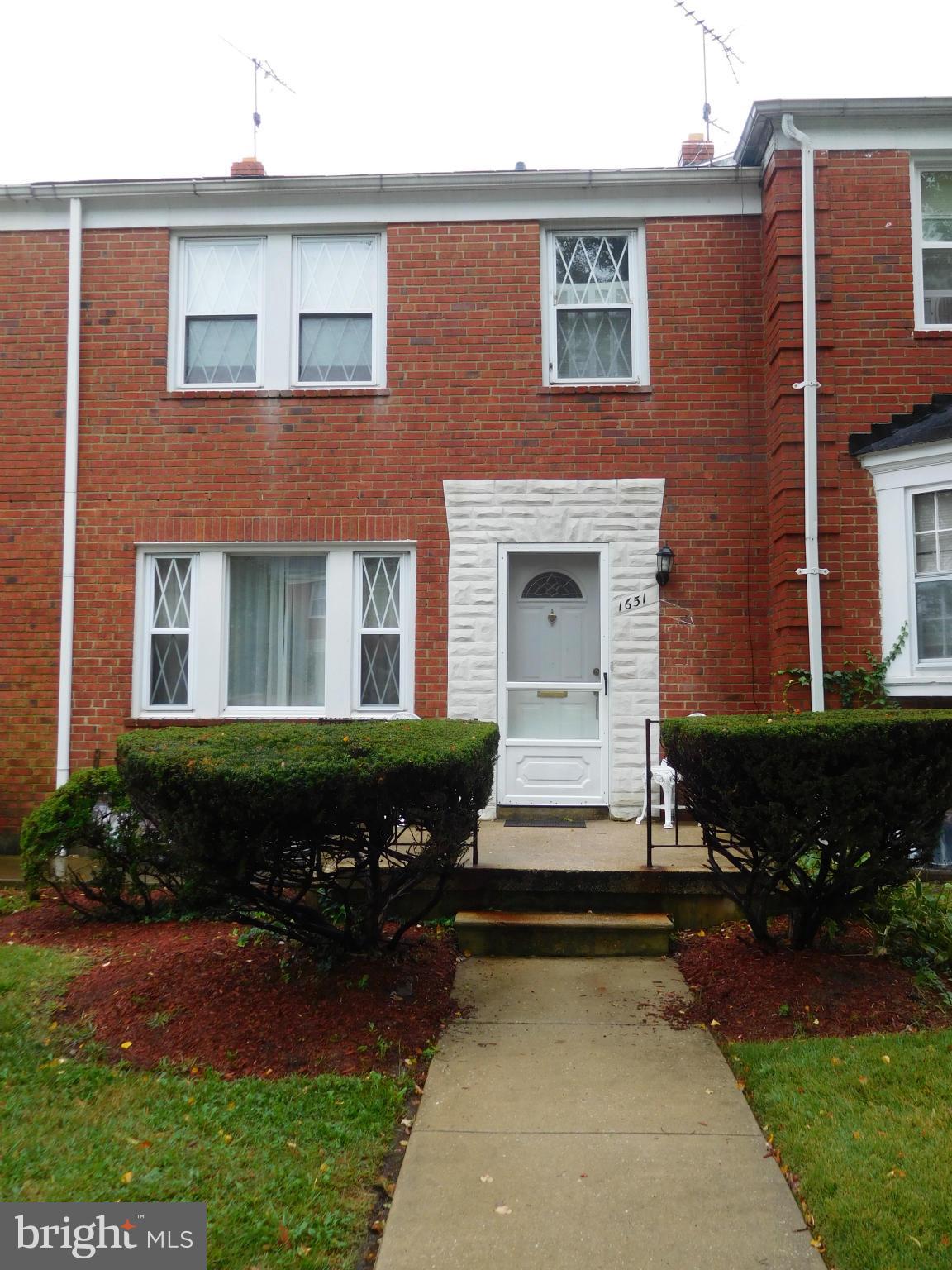 1651 Northbourne Road Baltimore, MD 21239 - Photo 1 of 30 a front view of a house with a garden
