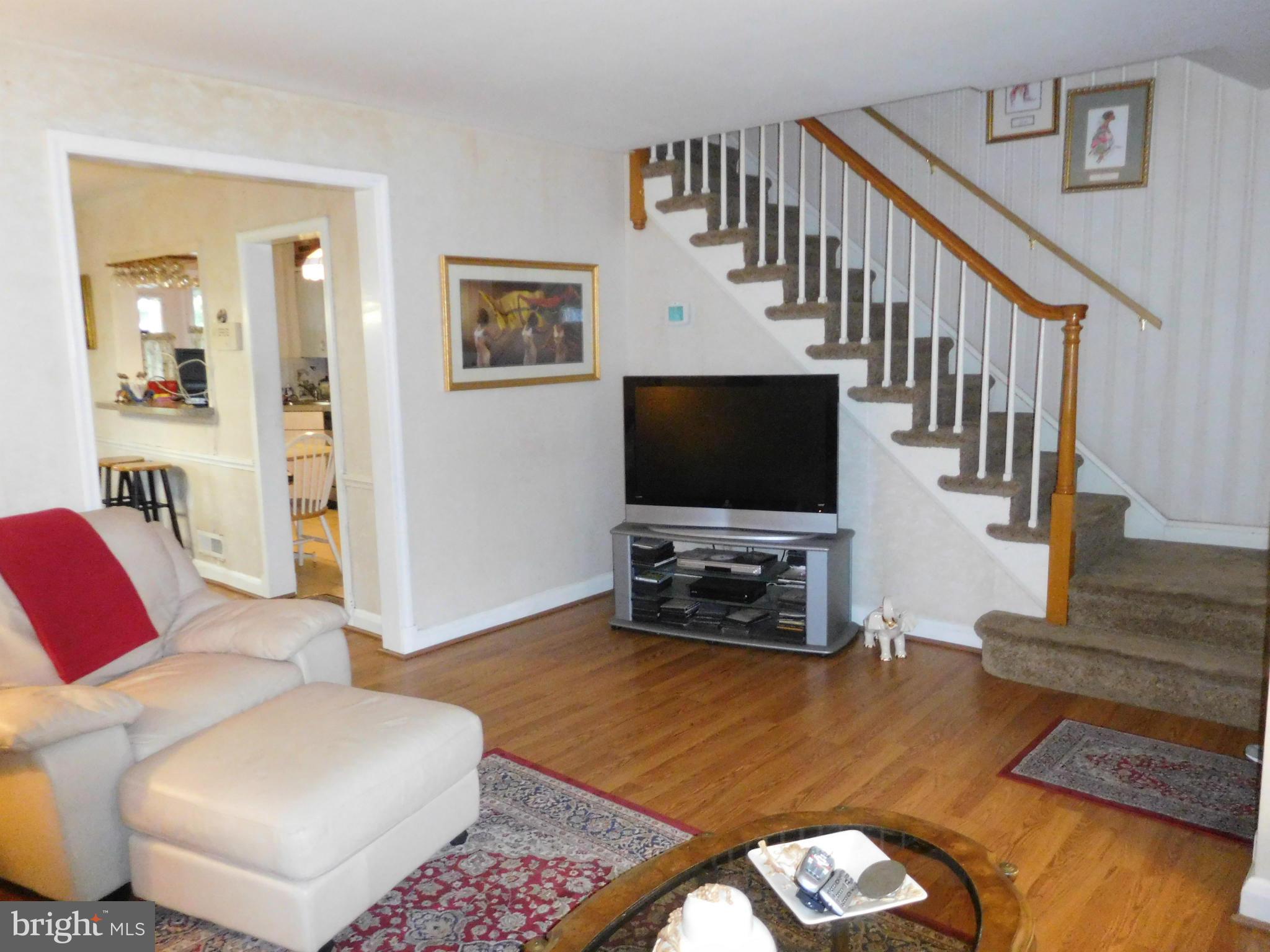 1651 Northbourne Road Baltimore, MD 21239 - Photo 2 of 30 a living room with furniture and a flat screen tv