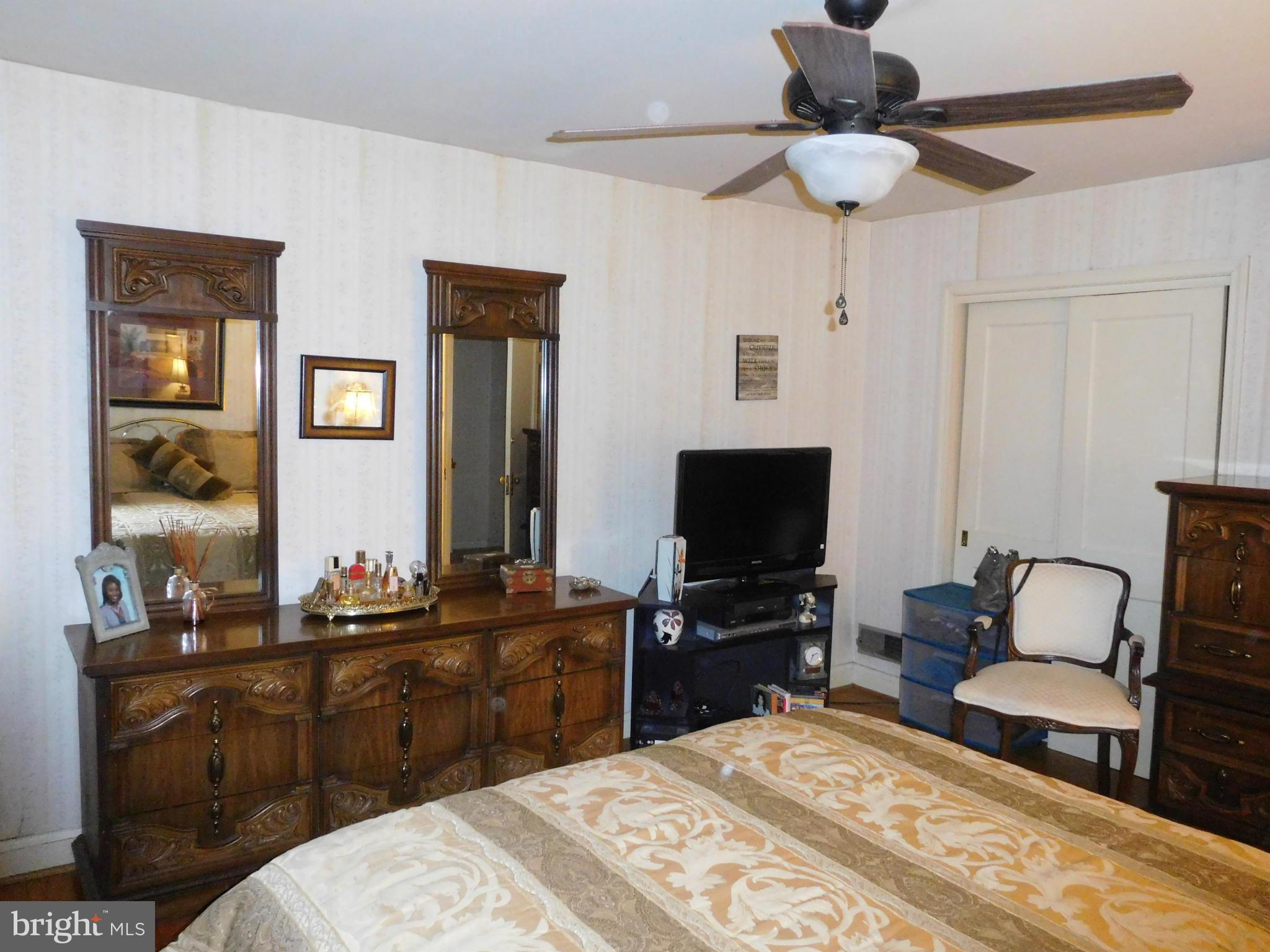 1651 Northbourne Road Baltimore, MD 21239 - Photo 11 of 30 a bedroom with a bed and a flat screen tv