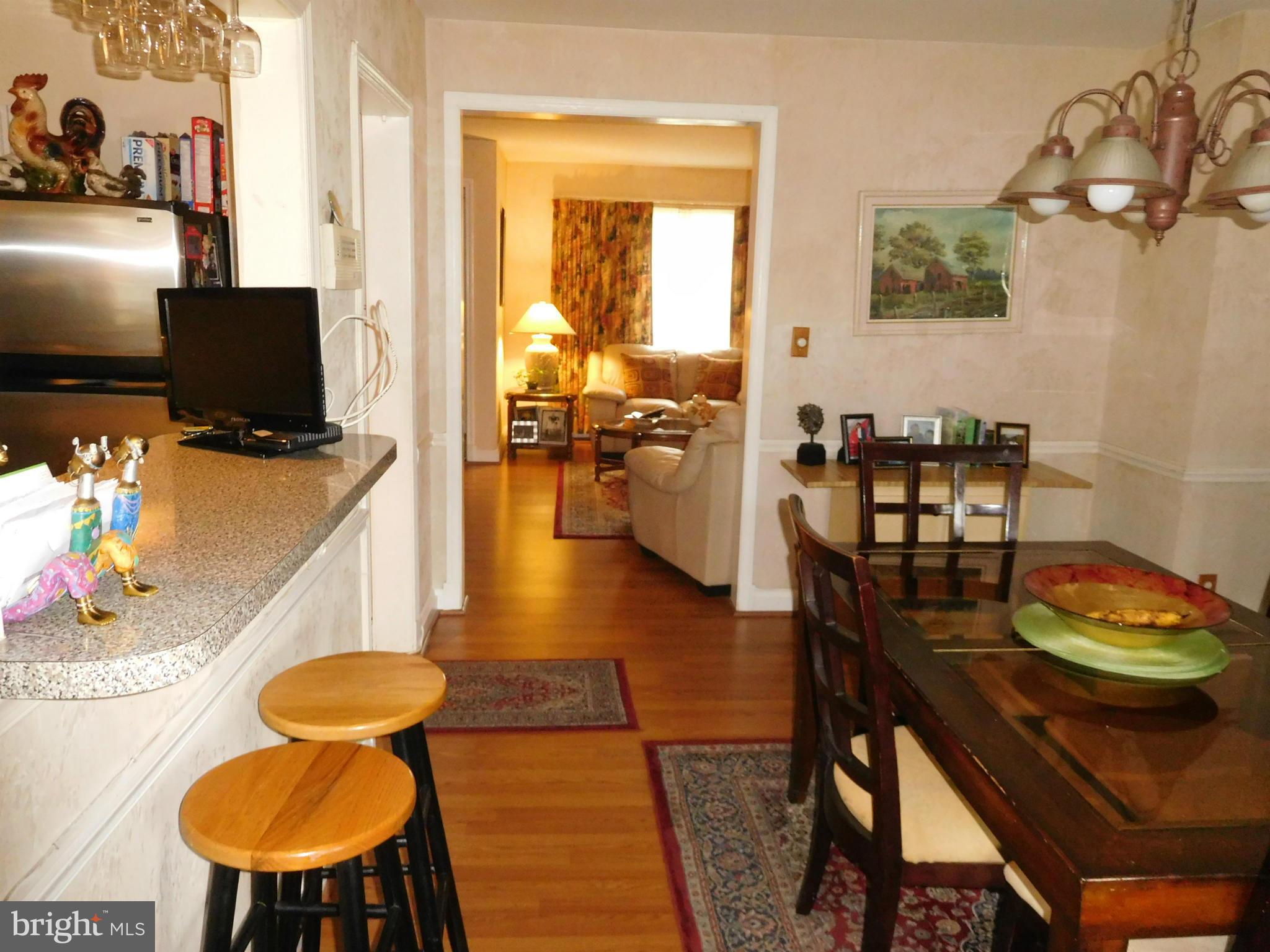 1651 Northbourne Road Baltimore, MD 21239 - Photo 18 of 30 a dining room with furniture and wooden floor