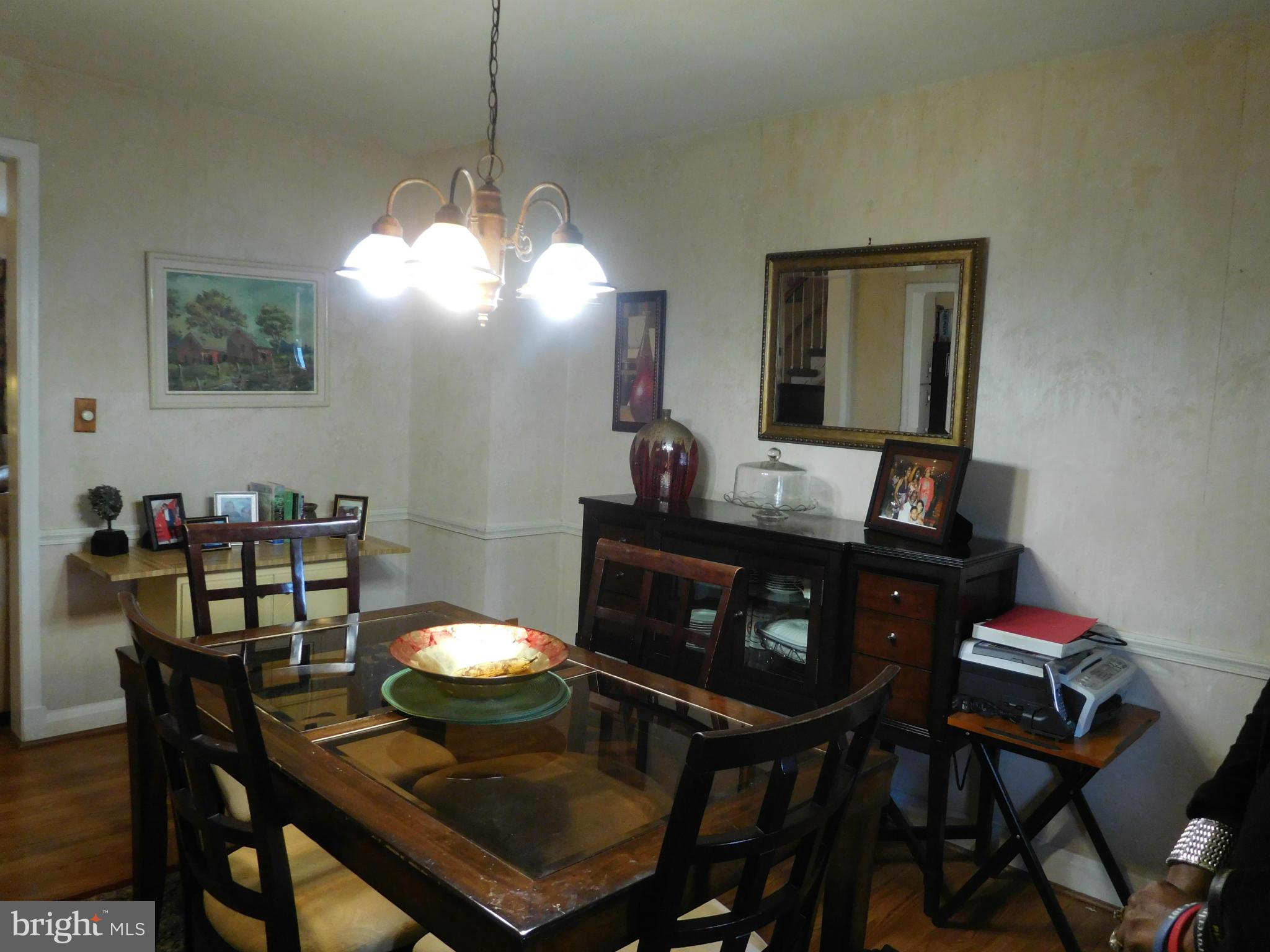 1651 Northbourne Road Baltimore, MD 21239 - Photo 20 of 30 a view of a dining room with a table and chairs