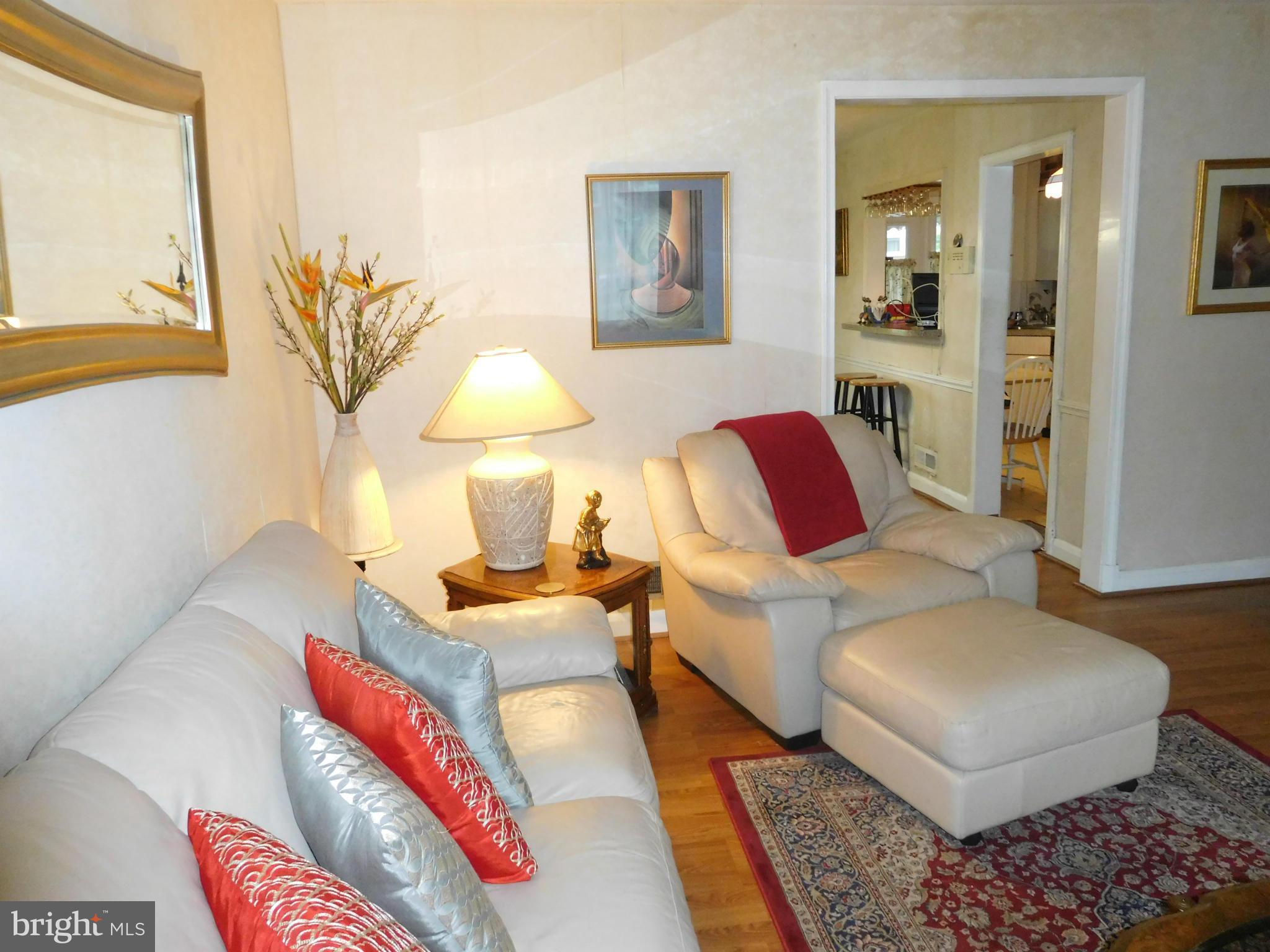 1651 Northbourne Road Baltimore, MD 21239 - Photo 3 of 30 a living room with furniture and a rug
