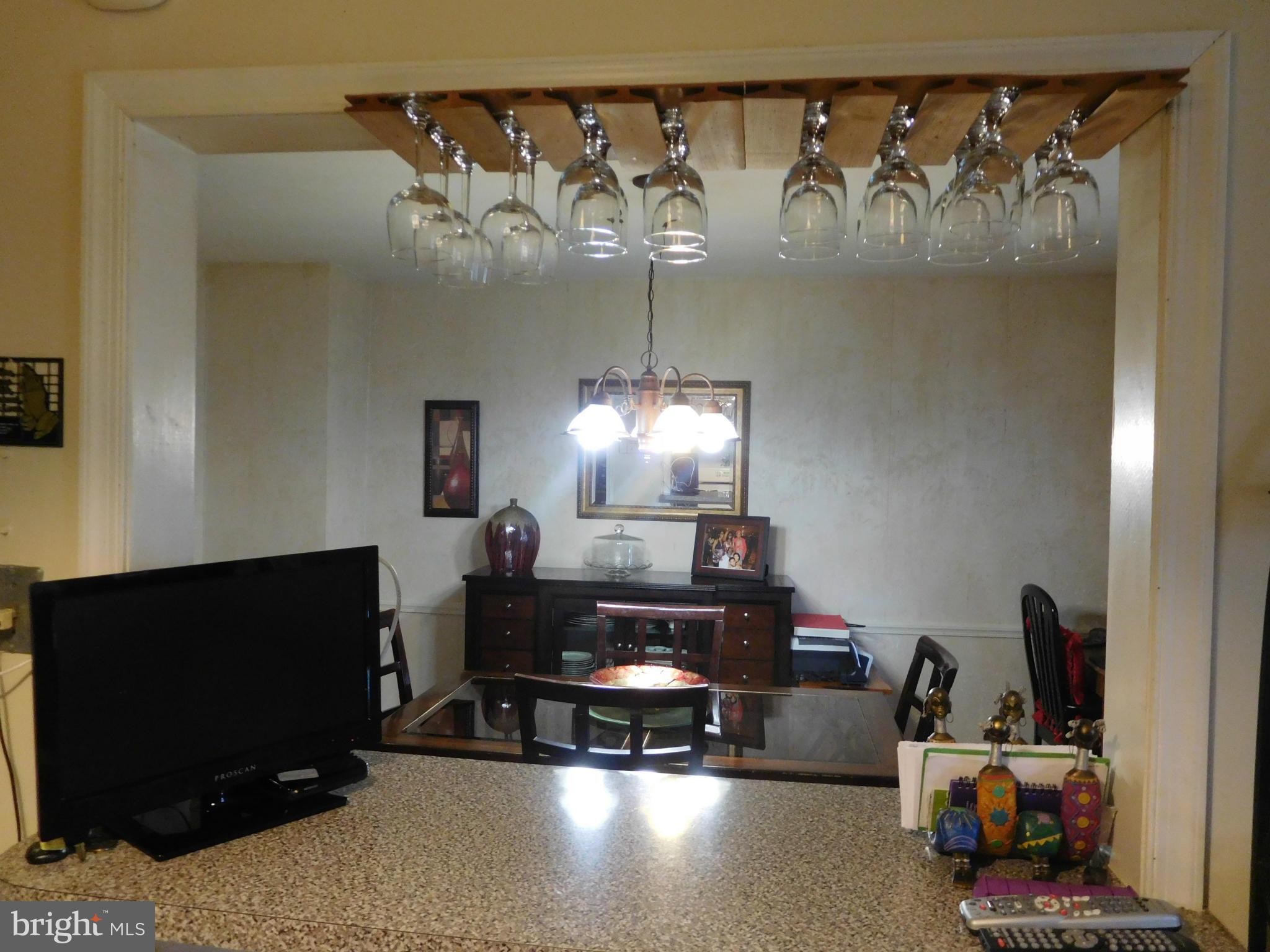 1651 Northbourne Road Baltimore, MD 21239 - Photo 22 of 30 a living room with furniture a flat screen tv and a fireplace