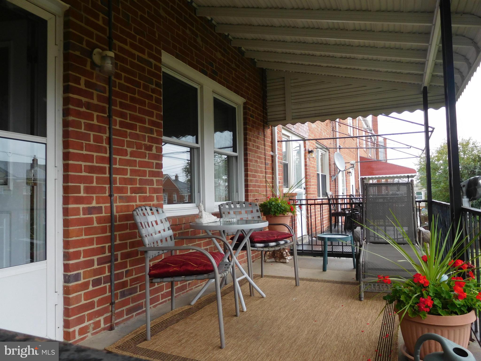 1651 Northbourne Road Baltimore, MD 21239 - Photo 28 of 30 a building outdoor space with patio furniture and potted plants