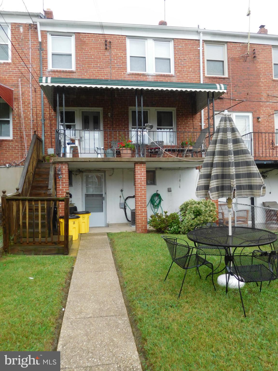 1651 Northbourne Road Baltimore, MD 21239 - Photo 30 of 30 a view of a house with roof deck and sitting area