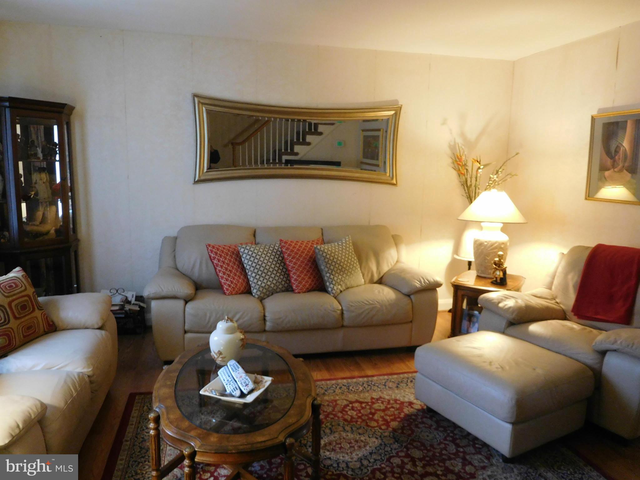 1651 Northbourne Road Baltimore, MD 21239 - Photo 4 of 30 a living room with furniture and a couch