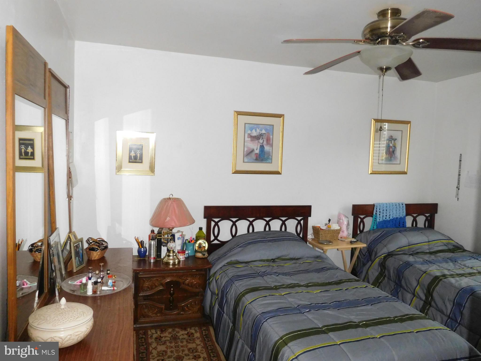1651 Northbourne Road Baltimore, MD 21239 - Photo 9 of 30 a bedroom with two beds and a chair