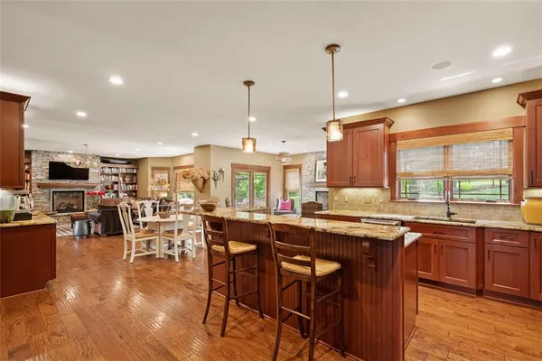 a spacious bedroom with a bed and a chandelier
