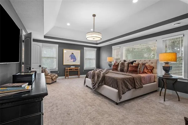 a large bathroom with a tub and shower