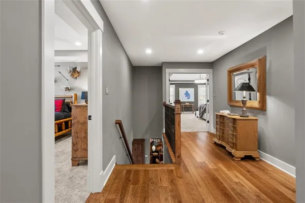 a living room with furniture a projector and screen
