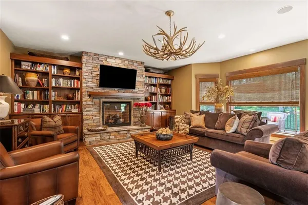 a living room with lots of furniture and wooden floors