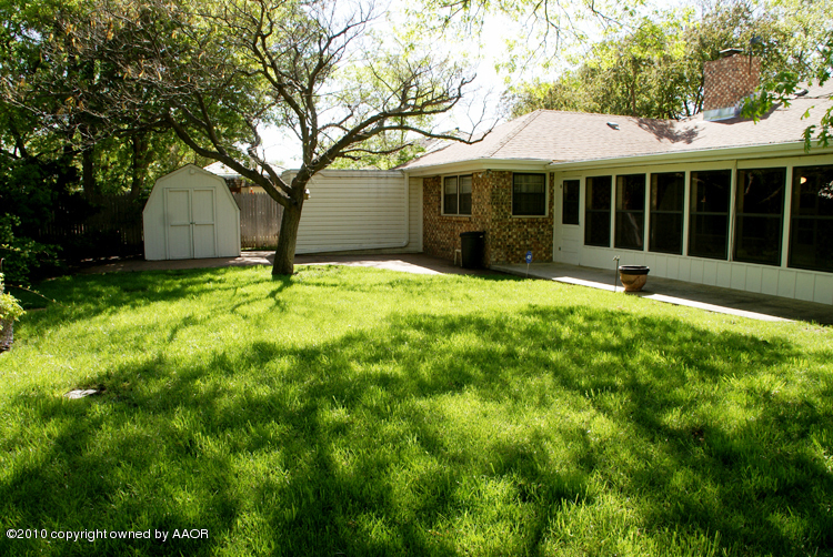 6117 Calumet Road Amarillo, TX 79106 - Photo 16 of 16 a view of a house with a yard and tree