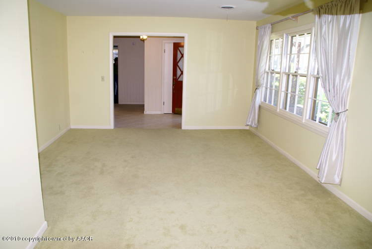 6117 Calumet Road Amarillo, TX 79106 - Photo 3 of 16 a view of an empty room with a window