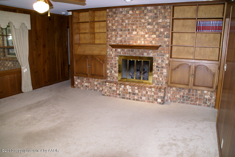 6117 Calumet Road Amarillo, TX 79106 - Photo 5 of 16 a view of fireplace and front door