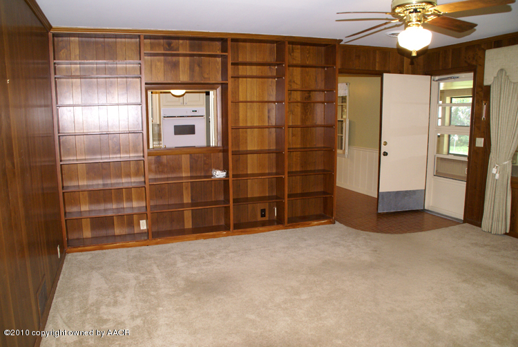 6117 Calumet Road Amarillo, TX 79106 - Photo 6 of 16 a view of an empty room with a fireplace