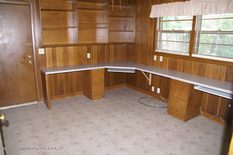 6117 Calumet Road Amarillo, TX 79106 - Photo 10 of 16 a view of an empty room with a window