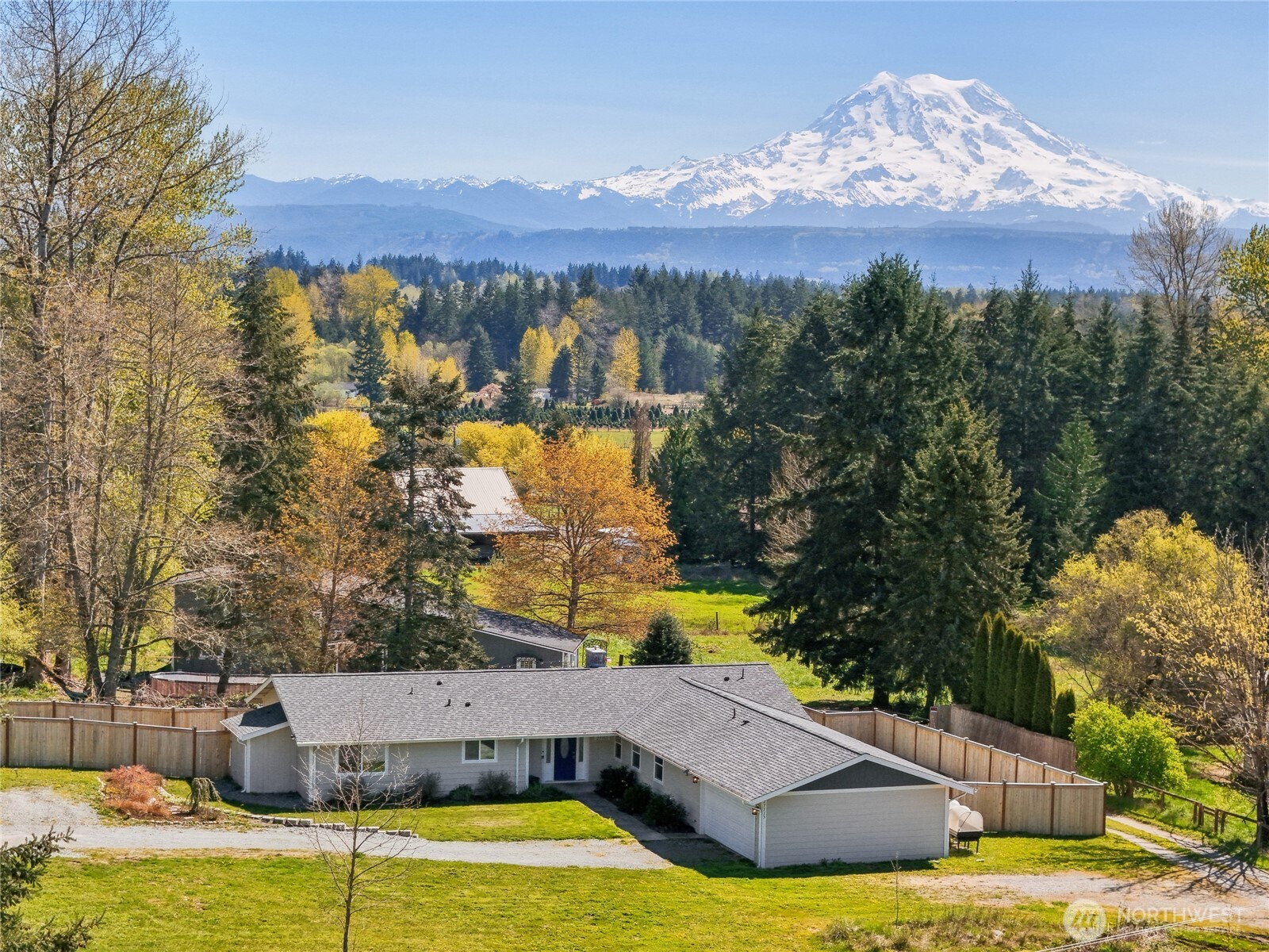 27713 Webster Road East Graham, WA 98338 - Photo 1 of 39 a view of a swimming pool with an outdoor space and seating area