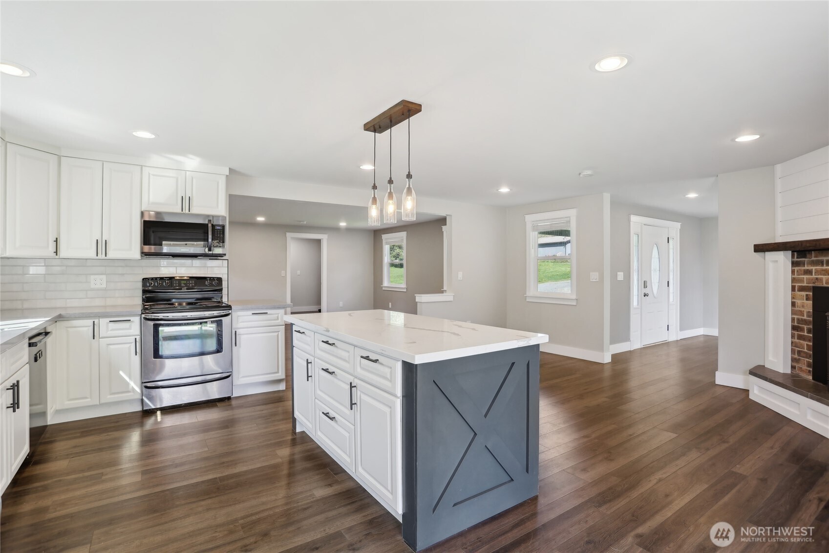 27713 Webster Road East Graham, WA 98338 - Photo 14 of 39 a kitchen with a stove a sink and a refrigerator