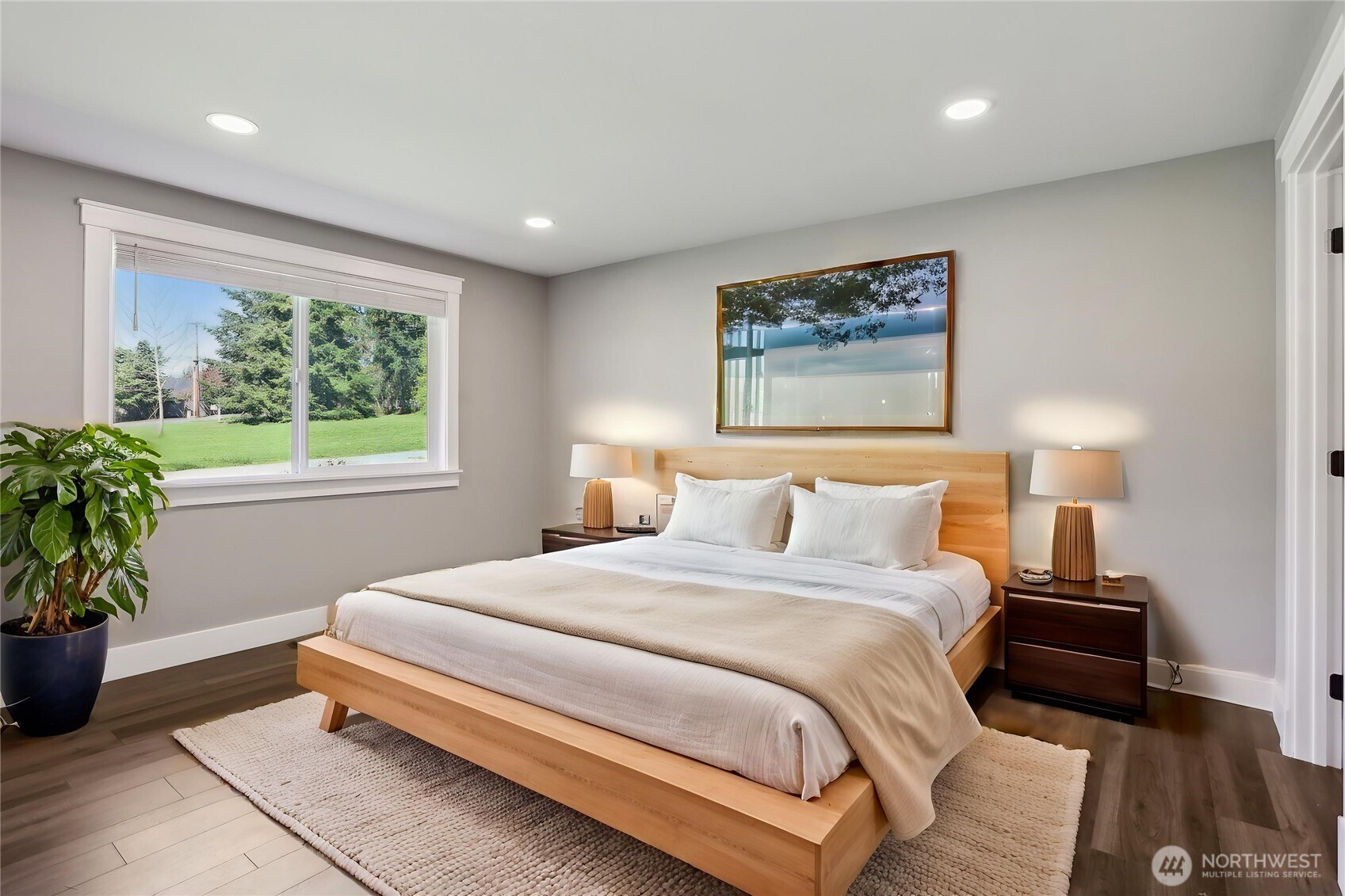 27713 Webster Road East Graham, WA 98338 - Photo 22 of 39 a bedroom with bed and a potted plant
