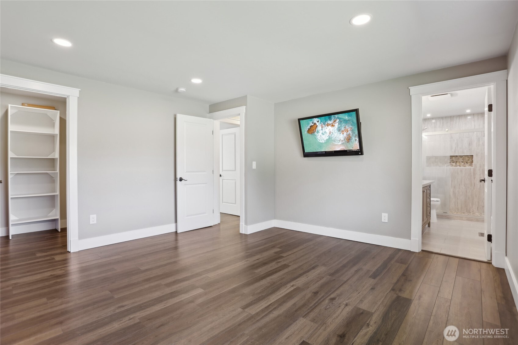 27713 Webster Road East Graham, WA 98338 - Photo 24 of 39 an empty room with wooden floor and windows