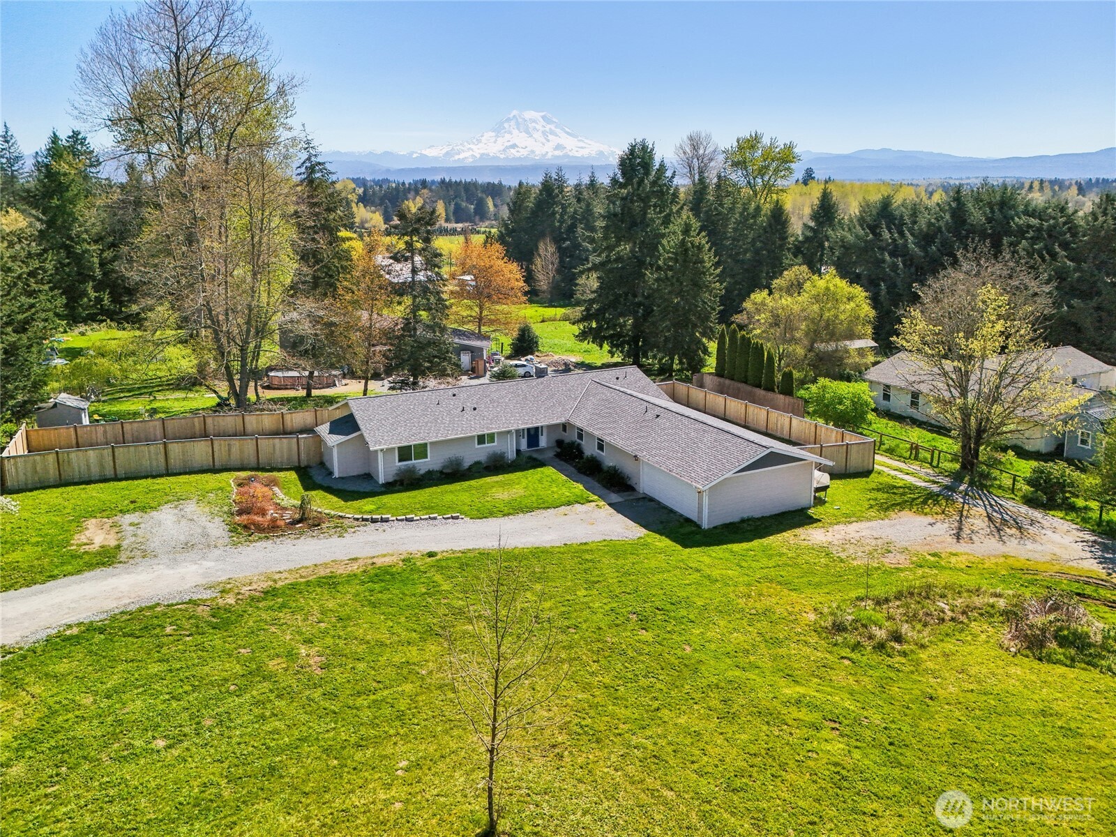 27713 Webster Road East Graham, WA 98338 - Photo 3 of 39 a view of a swimming pool with a yard