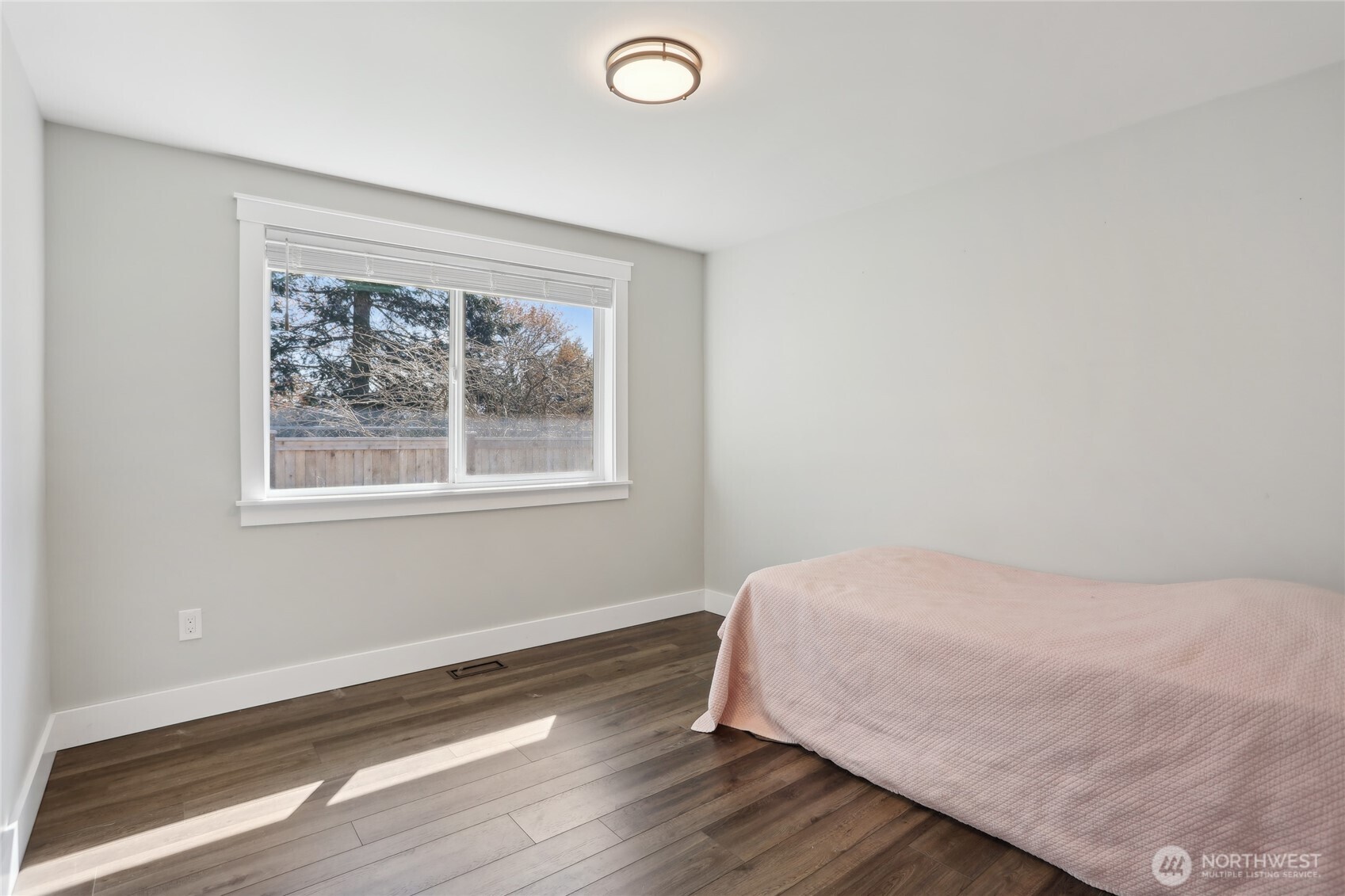 27713 Webster Road East Graham, WA 98338 - Photo 32 of 39 a bedroom with a bed and a window
