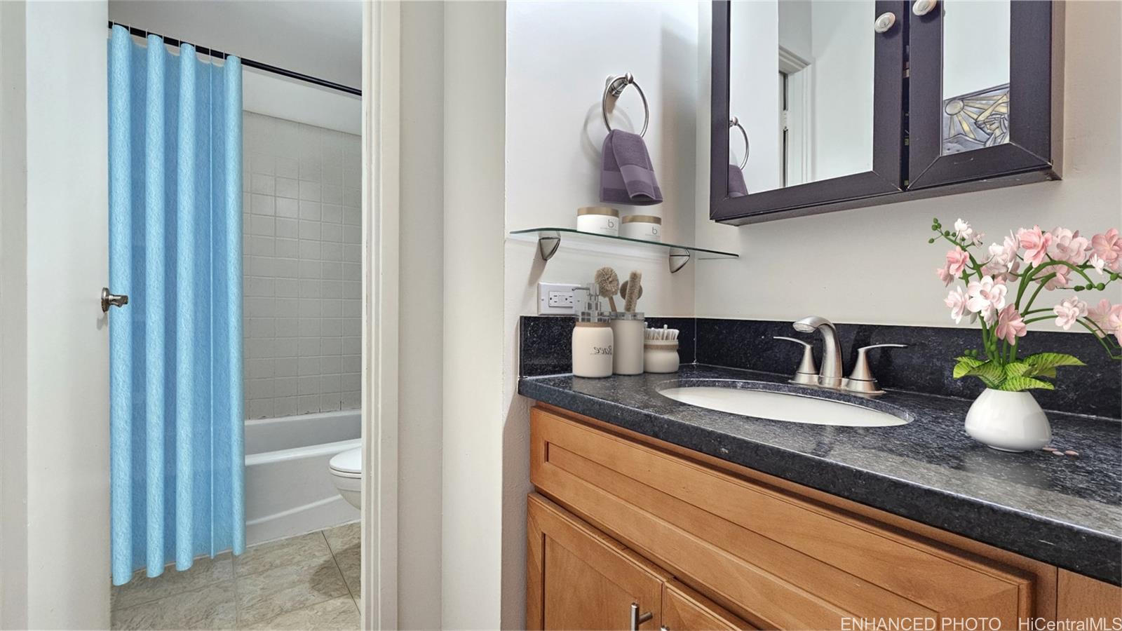 955 Ala Lilikoi Street, Unit 502 Honolulu, HI 96818 - Photo 12 of 21 a kitchen with granite countertop a sink stainless steel appliances and cabinets